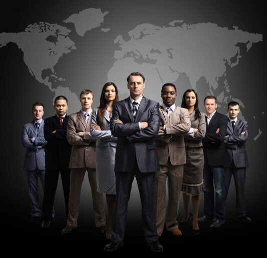 depositphotos_5658846-stock-photo-businessmen-standing-in-front-of